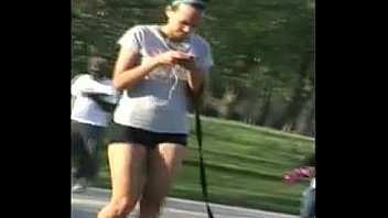 Girl Walking In Spandex Shorts At A Park