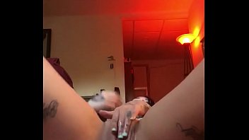 Tattooed babe Lexi fingers her wet cunt