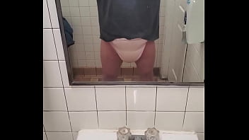 Showing off my soaked diapers in the bathroom at work.