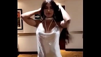 Hot Latina dancing with loose dress