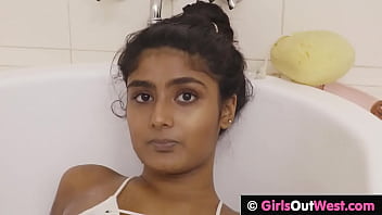 Small titted teen fingers and toys her horny hairy cunt in milk bath