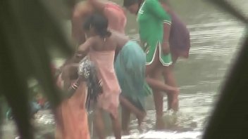 Indian women bathing by the river